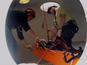 Rescue Technician Extracts Victim from Confined Space using SKED.