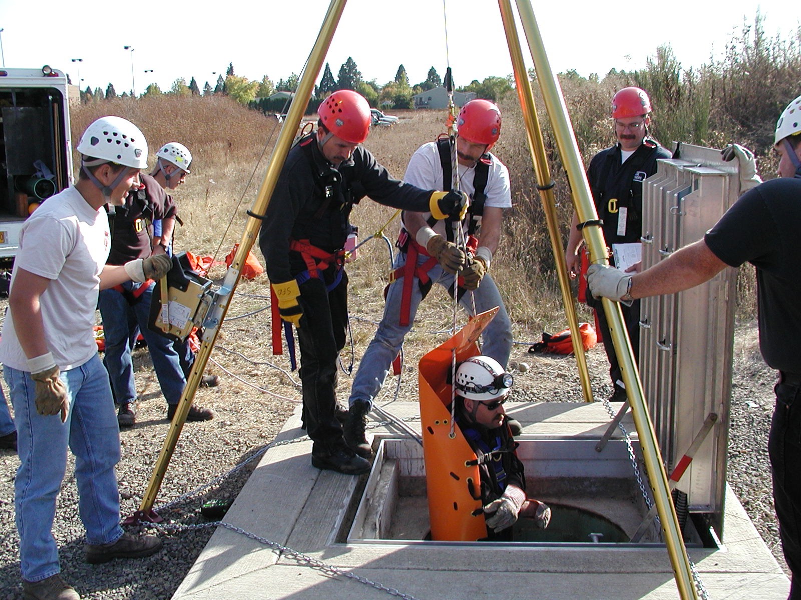 Industrial rescue team pulls the victim from a confined space.