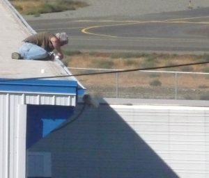 Worker too close to a roof edge.