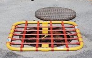 Temporary manhole cover to protect the confined space attendant from falls.