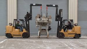 Using two forklifts